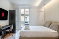 A bed or beds in a room at Bilocale Moderno - City Center