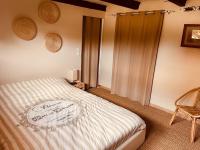 Katil atau katil-katil dalam bilik di Villa Individuelle Familiale 12 couchages