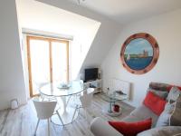 Televízia a/alebo spoločenská miestnosť v ubytovaní Beautiful apartment with sea views
