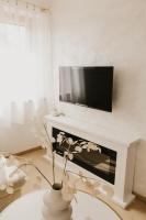 A television and/or entertainment centre at Hill View Apartment Tatragolf