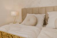 A bed or beds in a room at Hill View Apartment Tatragolf