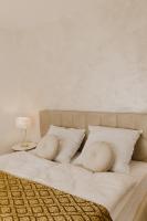 A bed or beds in a room at Hill View Apartment Tatragolf