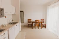 A kitchen or kitchenette at Hill View Apartment Tatragolf