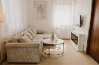 A television and/or entertainment centre at Hill View Apartment Tatragolf
