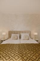 A bed or beds in a room at Hill View Apartment Tatragolf