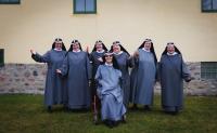 a group of women in robes posing for a picture at Birgittasystrarnas Gästhem in Vadstena