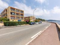 a street with cars parked on the side of a road at Apartment Le Grand Large-1 by Interhome in Sainte-Maxime