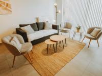 a living room with a couch and chairs and a rug at Apartment Rodenbach by Interhome in De Haan