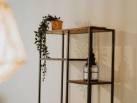 a shelf with a candle and a plant at Apartment Rodenbach by Interhome in De Haan