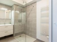 a bathroom with a glass shower and a sink at Apartment Cap Aréa by Interhome in Labenne