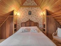Łóżko lub łóżka w pokoju w obiekcie Holiday Home Ker Vignan by Interhome