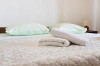 Posteľ alebo postele v izbe v ubytovaní Apartmani Erna
