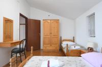 Posteľ alebo postele v izbe v ubytovaní Apartmani Erna