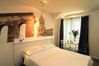 Posteľ alebo postele v izbe v ubytovaní La Porta Luxury Rooms
