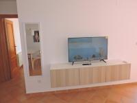 TV a/nebo společenská místnost v ubytování Bonito ático con terraza
