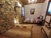 A bed or beds in a room at Lamprou V. House