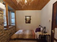 A bed or beds in a room at Lamprou V. House