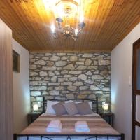 A bed or beds in a room at Lamprou V. House