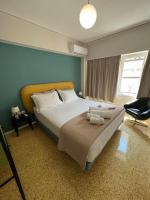 Posteľ alebo postele v izbe v ubytovaní Crown Syntagma Apartment