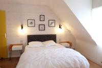 Posteľ alebo postele v izbe v ubytovaní La BERNIQUE Maison familiale Confort & Espace 3 chambres Jardin WIFI