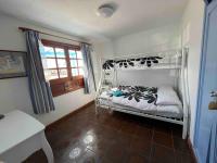 Postel nebo postele na pokoji v ubytování Villa Beachfront Famara