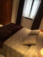 Cama o camas de una habitación en Hostal Alcázar