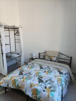 Łóżko lub łóżka w pokoju w obiekcie O'Couvent - Appartement 87m2 - 4 chambres - A511