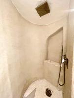 a bathroom with a shower with a toilet at SAN TEODORO PUNTA EST FANTASTICO TRILOCALE VISTA MARE in Capo Coda Cavallo