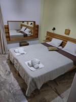 Postel nebo postele na pokoji v ubytování Kissandros Hotel