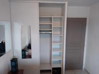 a white closet with empty shelves in a room at Rêve d une nuit d été in Aubagne