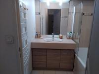 a bathroom with a sink and a mirror at Rêve d une nuit d été in Aubagne