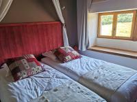 Łóżko lub łóżka w pokoju w obiekcie Le Moulin de la Fortie, Gîtes