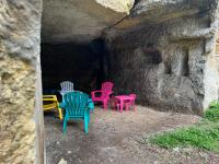 a group of colorful chairs sitting in a cave at Le Loft ~ à 4 min de la gare, Fibre + Parking privé in Poitiers
