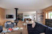 a living room with a couch and a fire place at Propriete spacieuse a Saint Trojan Vue mer in Saint-Trojan-les-Bains