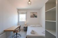 a small bedroom with a bed and a desk at L41 Suite Paladium parking 8pax 4rooms balcony WIFI&#47;AC in Nice