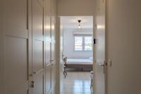 a hallway with a room with a bed and a window at L41 Suite Paladium parking 8pax 4rooms balcony WIFI&#47;AC in Nice