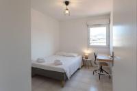 a bedroom with a bed and a desk and a window at L41 Suite Paladium parking 8pax 4rooms balcony WIFI&#47;AC in Nice