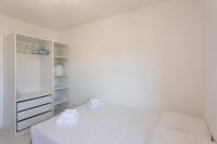 a white bedroom with a bed and a closet at L41 Suite Paladium parking 8pax 4rooms balcony WIFI&#47;AC in Nice