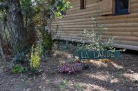a sign that says la landscape in front of a house at Chalet la lande in Ondres