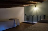 Posteľ alebo postele v izbe v ubytovaní Agriturismo Baglio Làuria