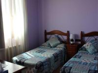 Posteľ alebo postele v izbe v ubytovaní HOSTAL LA SAVINA