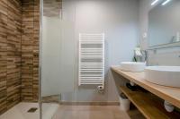a bathroom with two sinks and a shower at Charmant pavillon bordelais (logement entier) in Saint-Médard-en-Jalles