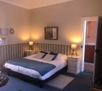 Ein Bett oder Betten in einem Zimmer der Unterkunft Le Domaine du Moulin Foulon