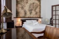 Postel nebo postele na pokoji v ubytování Santa Ana Suite & Rooms