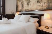 Postel nebo postele na pokoji v ubytování Santa Ana Suite & Rooms