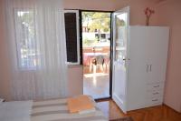 Posteľ alebo postele v izbe v ubytovaní Apartment and Rooms Toka