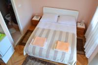 Posteľ alebo postele v izbe v ubytovaní Apartment and Rooms Toka