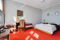 Łóżko lub łóżka w pokoju w obiekcie Hotel Sowa