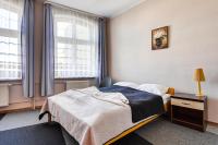 Łóżko lub łóżka w pokoju w obiekcie Hotel Sowa