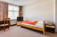 Łóżko lub łóżka w pokoju w obiekcie Hotel Sowa